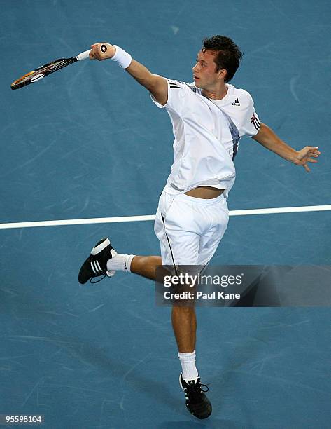 Philipp Kohlschreiber of Germany plays a back hand shot in his match against Andy Murray of Great Britain in the Group B match between Great Britain...