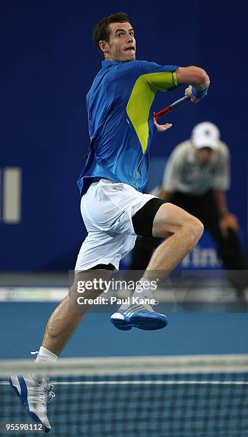 Andy Murray of Great Britain leaps for the ball in his match against Philipp Kohlschreiber of Germany in the Group B match between Great Britain and...