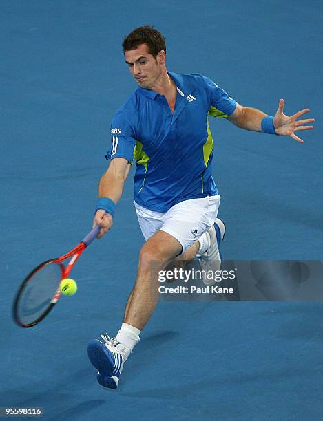 Andy Murray of Great Britain plays a forehand shot in his match against Philipp Kohlschreiber of Germany in the Group B match between Great Britain...