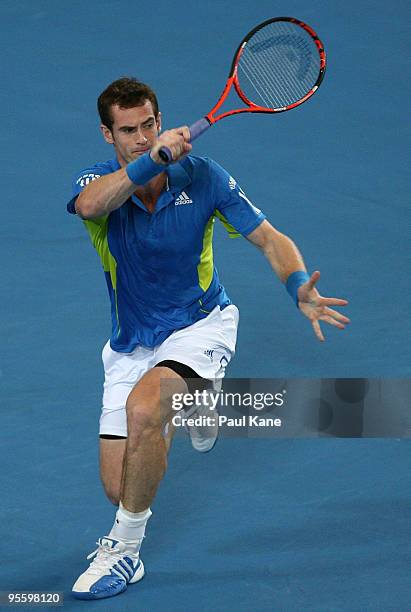 Andy Murray of Great Britain plays a forehand shot in his match against Philipp Kohlschreiber of Germany in the Group B match between Great Britain...