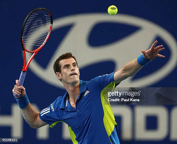 Andy Murray of Great Britain hits the ball into the crowd after defeating Philipp Kohlschreiber of Germany in the Group B match between Great Britain...