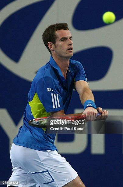Andy Murray of Great Britain plays a backhand shot in his match against Philipp Kohlschreiber of Germany in the Group B match between Great Britain...