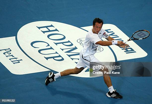 Philipp Kohlschreiber of Germany plays a back hand shot in his match against Andy Murray of Great Britain in the Group B match between Great Britain...