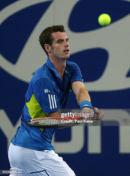 Andy Murray of Great Britain plays a backhand shot in his match against Philipp Kohlschreiber of Germany in the Group B match between Great Britain...