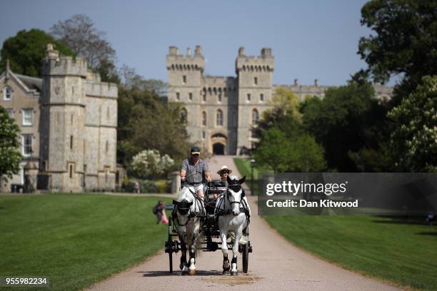 Horse drawn cart carries tourists along The Long Walk at Windsor Castle as it prepares for the wedding of Prince Harry and his fiance US actress...