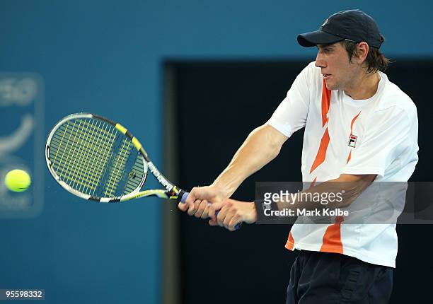 Carsten Ball of Australia plays backhand his second round match against Andy Roddick of the USA during day four of the Brisbane International 2010 at...