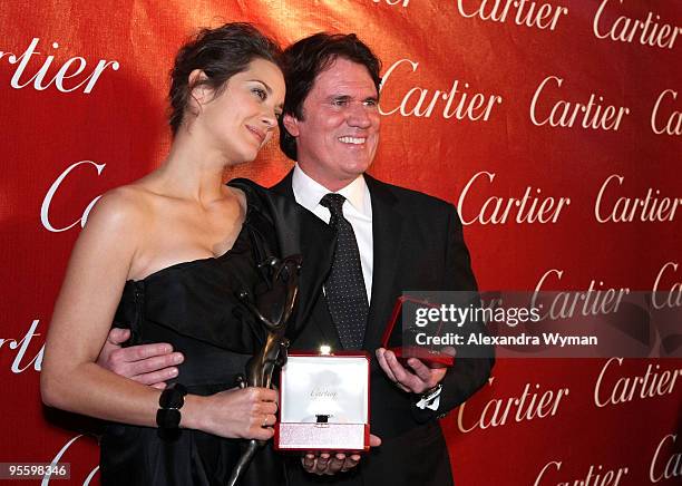 Actress Marion Cotillard and driector/producer Rob Marshall pose backstage during the 2010 Palm Springs International Film Festival gala held at the...
