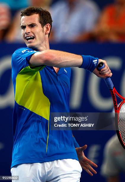 Andy Murray of Britain returns the ball against Philipp Kohlschreiber of Germany during their singles match on the seventh session, day five of the...