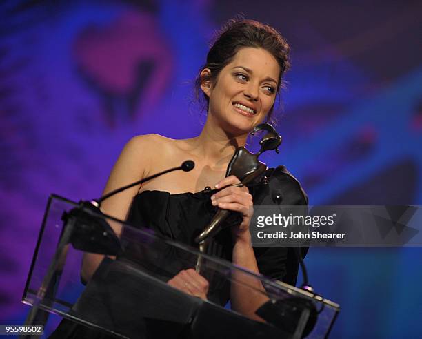 Actress Marion Cotillard accepts the Desert Palm Achievement Award - Actress onstage at the 2010 Palm Springs International Film Festival gala held...