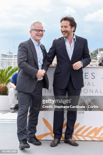 Cannes Film Festival Director Thierry Fremaux greets Master of Ceremonies Edouard Baer at the Master of Ceremonies photocall during the 71st annual...