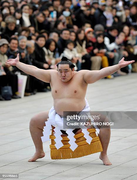 Mongolian-born 'yokozuna', or sumo grand champion, Asashoryu demonstrates a ceremonial performance to mark the new year at Meiji Shrine in Tokyo on...