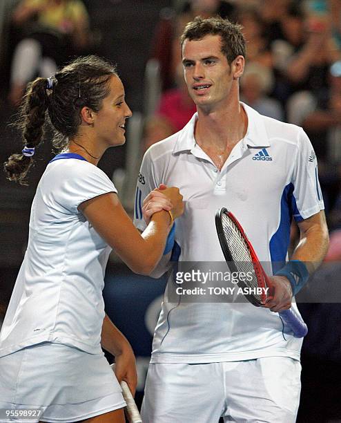 Andy Murray and Laura Robson of Britain celebrate after beating Philipp Kohlschreiber and Sabine Lisicki of Germany in their mixed doubles match on...