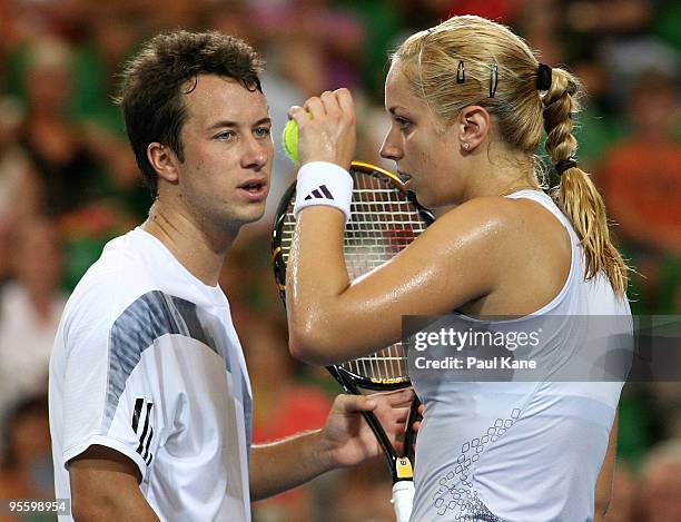 Philipp Kohlschreiber and Sabine Lisicki of Germany talk tactics during the mixed doubles match against Andy Murray and Laura Robson of Great Britain...