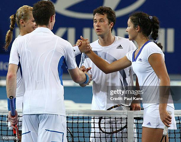 Andy Murray and Laura Robson of Great Britain shake hands with Philipp Kohlschreiber and Sabine Lisicki of Germany after the mixed Group B doubles...