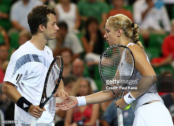 Philipp Kohlschreiber and Sabine Lisicki of Germany celebrate a point during the mixed doubles match against Andy Murray and Laura Robson of Great...