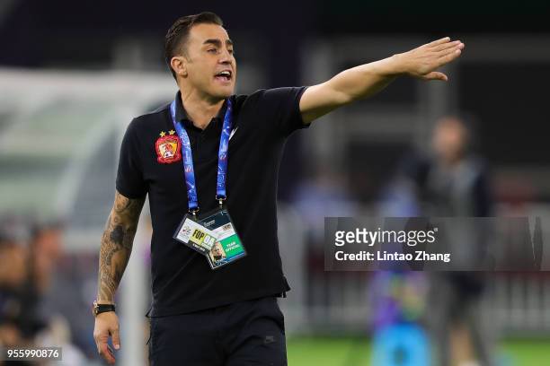 Head coach Fabio Cannavaro of Guangzhou Evergrande gestures during the AFC Champions League Round of 16 first leg match between Tianjin Quanjian and...