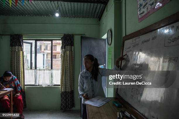 Nepali women attend a local language course, taught by Sonam Chhoki Sherpa, a 21-year-old teacher, at The Volunteer Society Nepal's Women's center on...