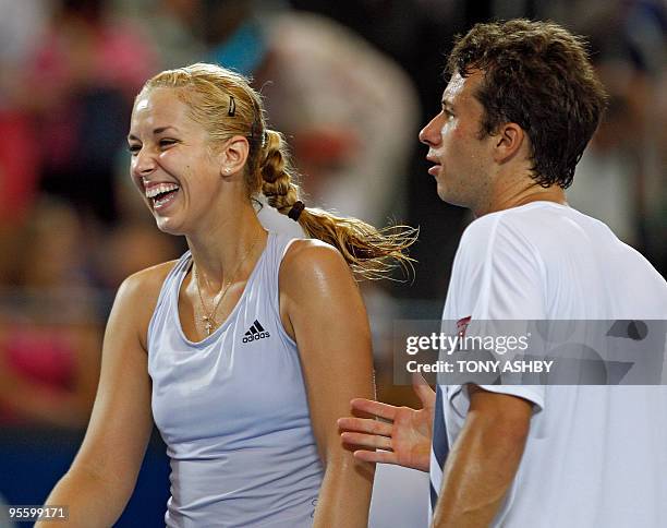 Philipp Kohlschreiber and Sabine Lisicki of Germany are pictured after their mixed doubles loss to Andy Murray and Laura Robson of Britain on the...