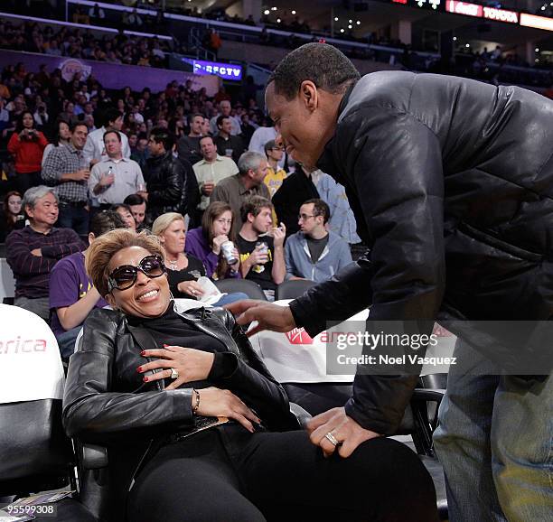 Mary J. Blige and her husband Martin Kendu Isaacs attend a game between the Houston Rockets and the Los Angeles Lakers at Staples Center on January...