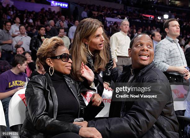 Mary J. Blige, Maria Shriver and Martin Kendu Isaacs attend a game between the Houston Rockets and the Los Angeles Lakers at Staples Center on...