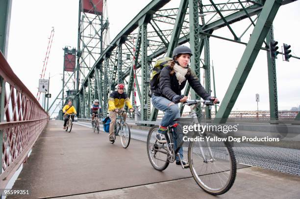 people biking in bike lane over bridge - cykelbana bildbanksfoton och bilder