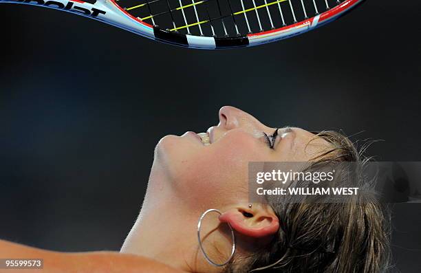 Timea Bacsinszky of Switzerland reacts in her loss to Ana Ivanovic of Serbia at the Brisbane International tennis tournament, in Brisbane on January...