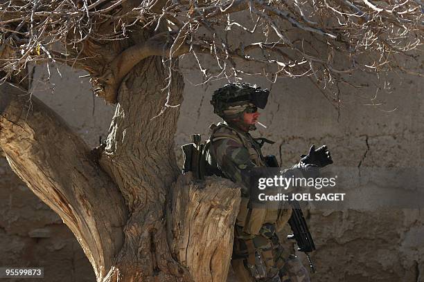 French soldier of the 13 BCA smokes a cigarette at Jalokhel in Kapisa province just after a TIC with the insurgents on January 5, 2010. About 113,000...