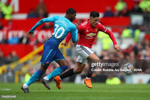 Ainsley Maitland-Niles of Arsenal and Alexis Sanchez of Manchester United during the Premier League match between Manchester United and Arsenal at...