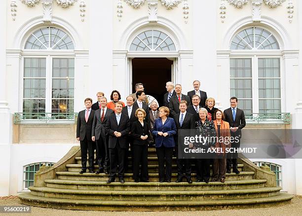 Germany's new cabinet poses for a group photo as they meet for a closed-door cabinet meeting in Meseberg, north of Berlin, on November 17, 2009....