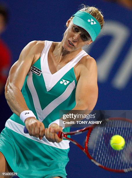 Elena Dementieva of Russia hits a return against Yaroslava Shvedova of Kazakhstan during their women's singles match on the eighth session of day...