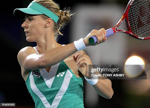 Elena Dementieva of Russia hits a return against Yaroslava Shvedova of Kazakhstan during their women's singles match on the eighth session of day...