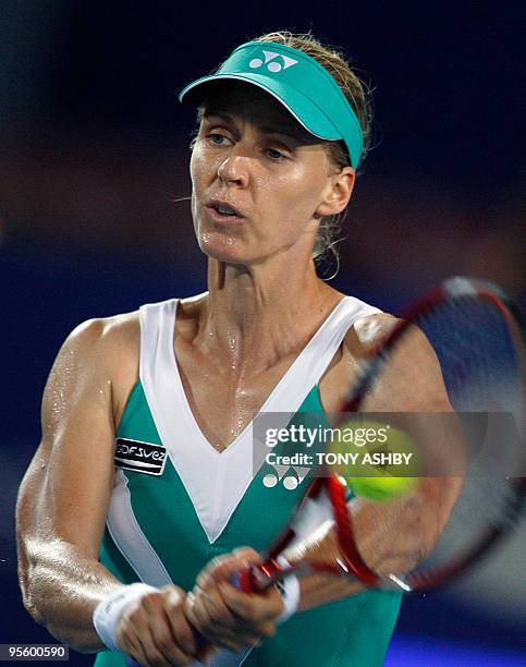 Elena Dementieva of Russia hits a return against Yaroslava Shvedova of Kazakhstan during their women's singles match on the eighth session of day...