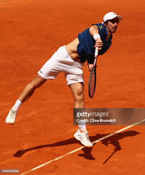 Pablo Cuevas of Argentina serves against Jack Sock of the United States in their first round match during day four of the Mutua Madrid Open tennis...