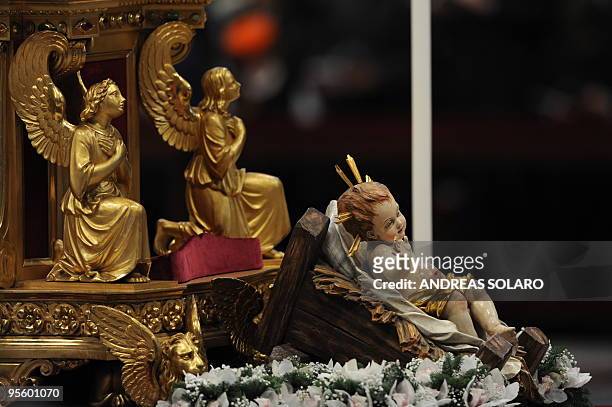 Christ crib figurine is displayed as Pope Benedict XVI celebrates the mass of the Epiphany in St Peter's Basilica on January 6, 2010 at The Vatican....