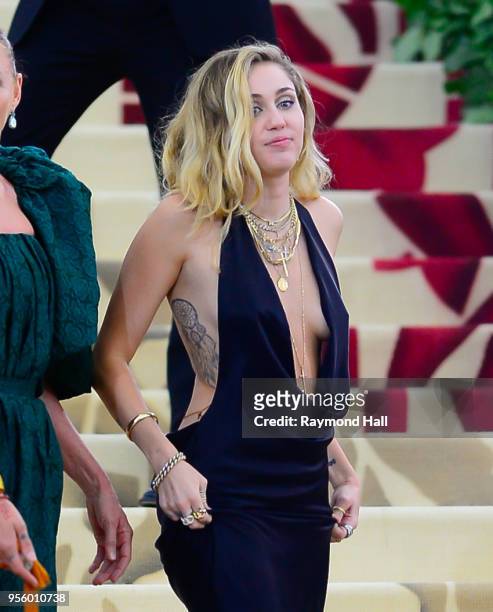 Miley Cyrus attends the Heavenly Bodies: Fashion & The Catholic Imagination Costume Institute Gala at The Metropolitan Museum of Art at on May 7,...