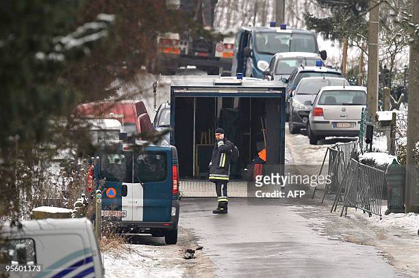 Police set up a security cordon around the house of a suspect named as Ronald J. Who was arrested in connection with a double murder in Loksbergen on...