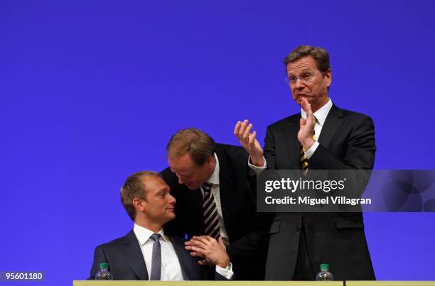 German Foreign Minister and German Free Democrats Chairman Guido Westerwelle and German Development Minister Dirk Niebel congratulate Christian...