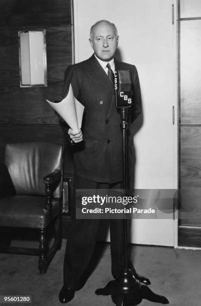 American director Cecil B. DeMille at the microphone in a CBS radio studio, circa 1935.