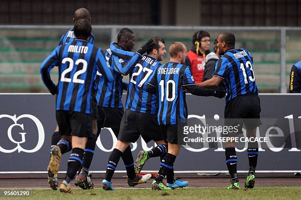 Inter Milan's forward Mario Balotelli celebrates with teammates after scoring against Chievo during their Italian Serie A football match on January...