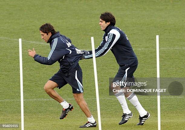 Real Madrid's Brazilian midfielder Kaka and Real Madrid captain Raul Gonzalez are pictured during a training session of the Real Madrid squad at the...
