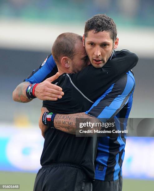 Marco Materazzi and Wesley Sneijder of FC Inter Milan celebrate the victory hugging each other after the Serie A match between AC Chievo Verona and...