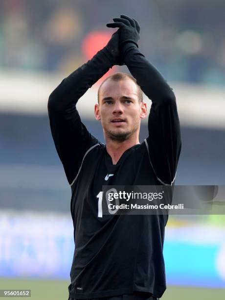 Wesley Sneijder of FC Inter Milan celebrates the victory cheering his fans after the Serie A match between AC Chievo Verona and FC Inter Milan at...
