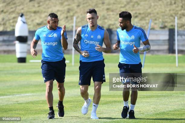 Olympique de Marseille's French forward Dimitri Payet, Argentinian forward Lucas Ocampos and French defender Jordan Amavi warm up during the Europa...