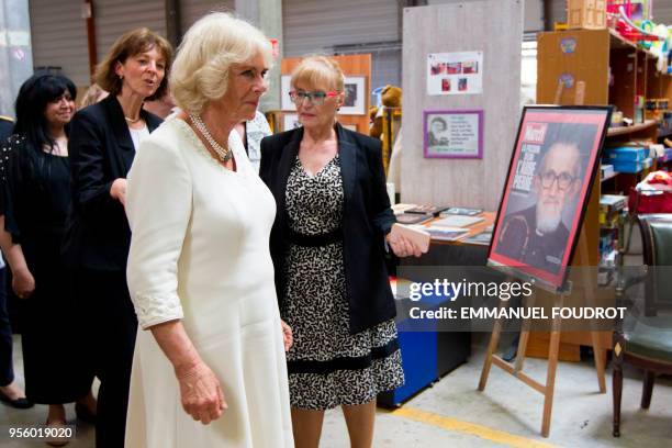 Britain's Camilla , Duchess of Cornwall, visits a second-hand shop of the Emmaus solidarity movement in Venissieux near Lyon, eastern France, on May...