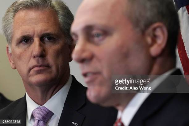 House Majority Leader Rep. Kevin McCarthy listens as House Majority Whip Rep. Steve Scalise speaks during a news conference May 8, 2018 at the U.S....