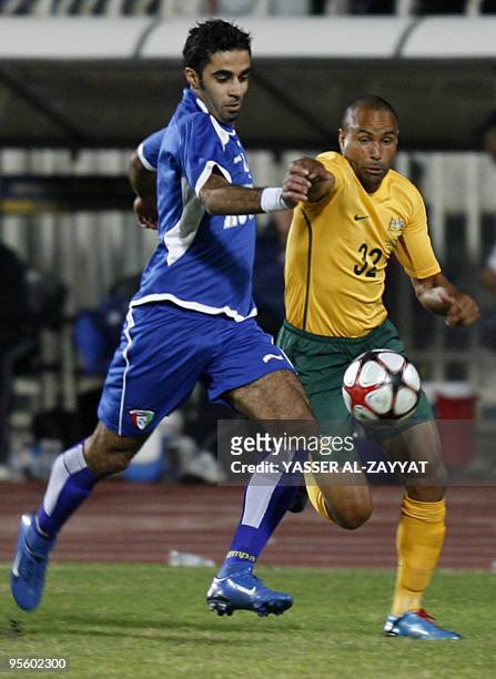 Australia's national soccer team player Archi Gerald fights for the ball with Kuwaiti's Hussein Ali during their Asian Cup 2011 qualifying match in...
