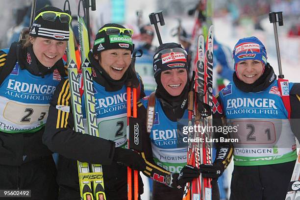 The team of Germany Tina Bachmann, Simone Hauswald, Andrea Henkel and Martina Beck pose after winning the second place in the Women's 4 x 6km Relay...