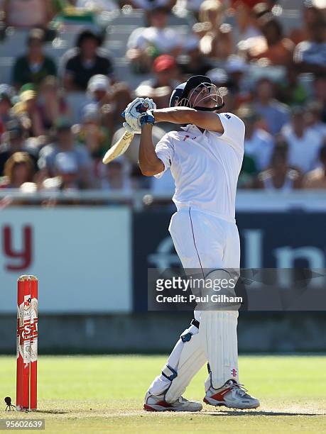Alastair Cook of England hits out only to be caught behind by Mark Boucher of South Africa off the bowling of Friedel de Wt of South Africa for 55...