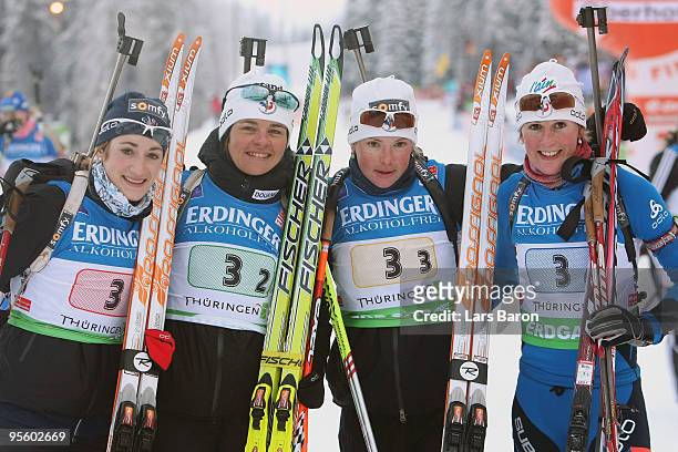 The team of France Marie Laure Brunet, Sylvie Becaert, Marie Dorin, Sandrine Bailly pose after winning the third place in the Women's 4 x 6km Relay...