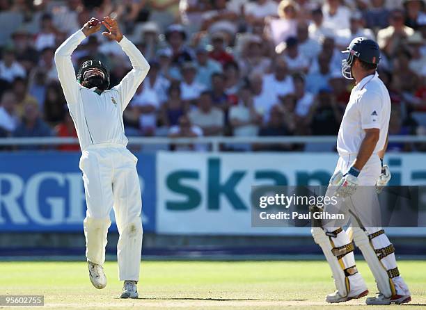 Captain Andrew Strauss of England looks on as he is caught out by Hashim Amla of South Africa for 45 runs off the bowling of Paul Harris of South...